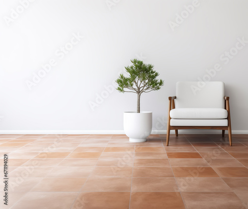 Modern white armchair with wooden legs and potted green pine tree in an empty room with white wall and terracotta colored ceramic floor. Copy space.