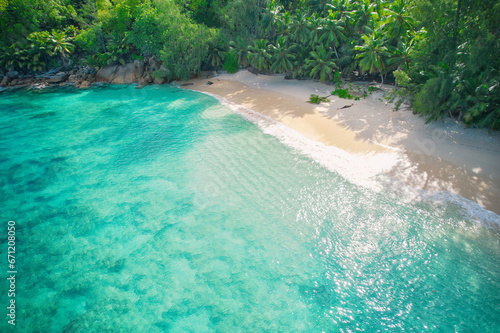 Drone bird eye view at Anse solei beach, white sandy beach, turquoise and calm sea and trees, Mahe Seychelles 2