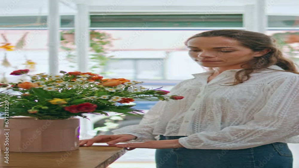 Flower store retailer work make bouquet in spring plant shop business vertical. Flower store retailer work make bouquet in spring plant shop business vertical.