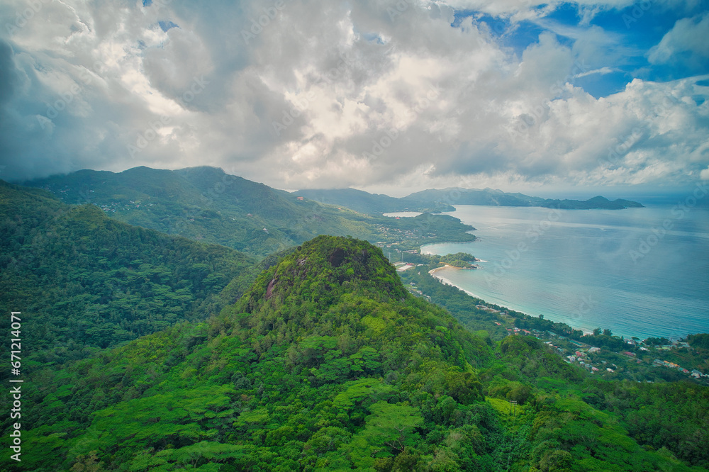 Drone shot from tea factory, view from the south west to west coast of Mahe behind mont sephale, cloudy sky, Mahe Seychelles