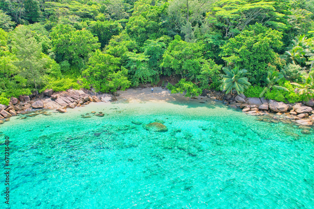 Drone shot of Anse Major beach, Man lifting both arms, Mahe, Seychelles 2 Drone shot of Anse Major beach, Man lifting both arms, Mahe, Seychelles 2
