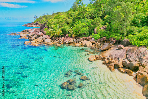  Drone shot of Anse Major beach, transparent sea, lush forest and granite stones, Mahe, Seychelles © Nils