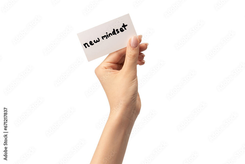 New mindset - new result text on a card in a woman hand. New mindset - new result text on a card in a woman hand.