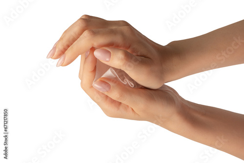 Wet wipe in a woman hand isolated on a white background.