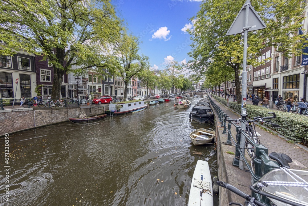 View over a typical canal in the Dutch metropolis Amsterdam in summer 2023