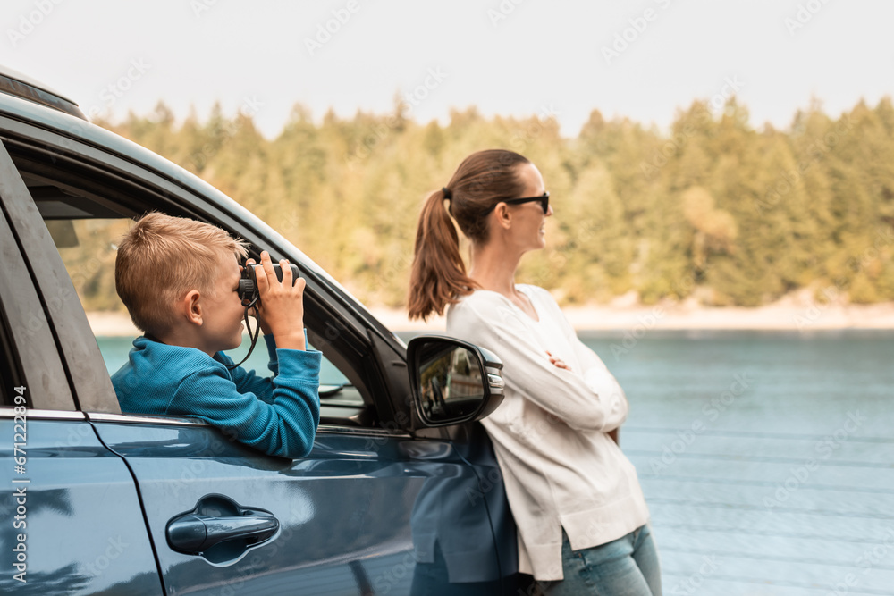 Holiday and travel family concept, Happy family enjoying road trip by car stoping to enjoy nature lake forest view 