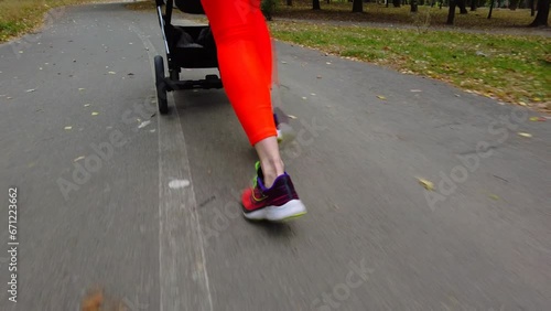 young woman running with a stroller doing sports 