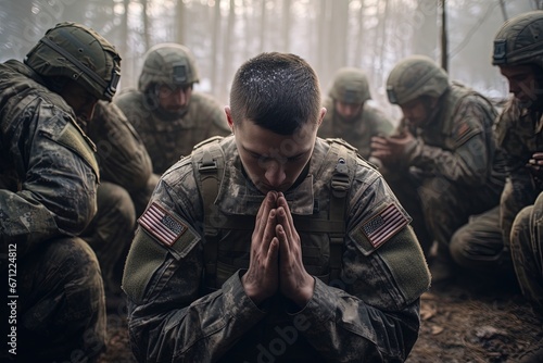 Soldiers pray to God on knees.