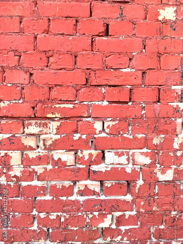 Colorful brick wall on the house. Texture of red stone blocks  close up. Background.