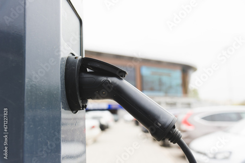 Charging a modern electric car close-up.