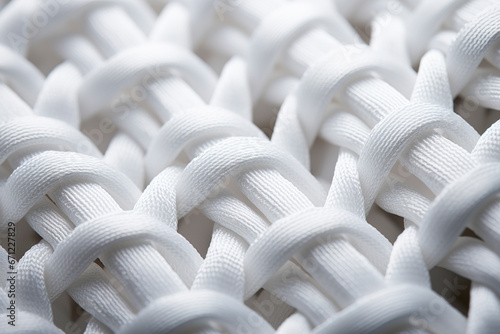 Obraz na płótnie Close-up of white cotton fabric interlaced fiber macro, white synthetic cotton threads background, macro photography of white synthetic material, synthetic white fabric fibers background. w salonie