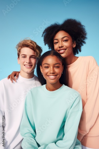 A group portrait with teenage models with different skin tones and genders