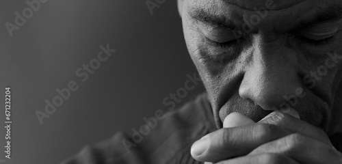 man praying to god on gray background with people stock image stock photo	 #671232204