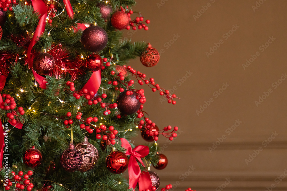 Christmas interior in red and brown tones. Beautiful furniture in the living room, Christmas tree with toys Christmas interior in red and brown tones. Beautiful furniture in the living room, Christmas tree with toys