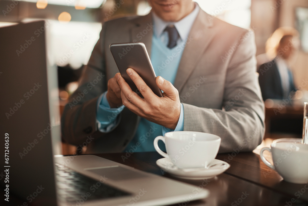 Professional checking his smartphone during a coffee break Professional checking his smartphone during a coffee break