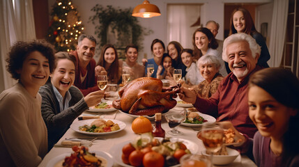 Group of multiethnic friends having dinner together at home. Cheerful mature men and women sitting at festive table and celebrating Thanksgiving.