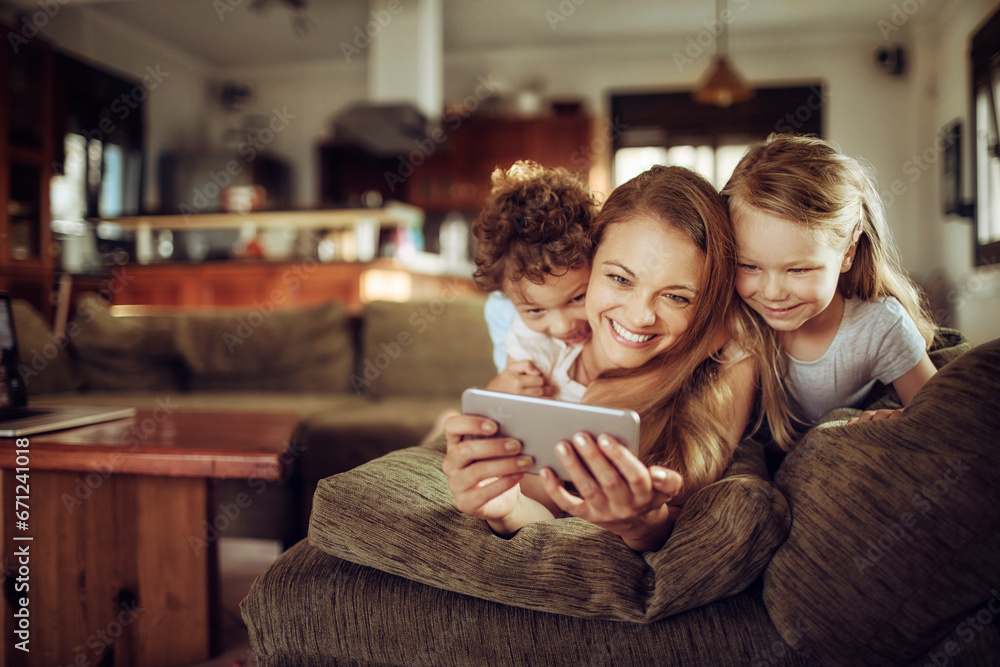 Mother and children enjoying a moment with a smartphone Mother and children enjoying a moment with a smartphone