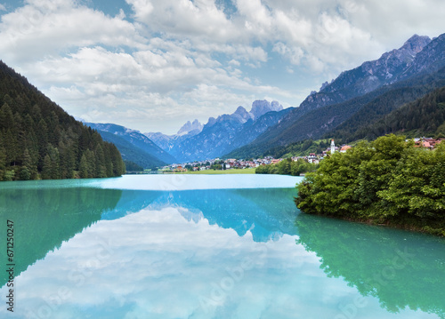 Tranquil summer Italian dolomites mountain lake and village view  Auronzo di Cadore 