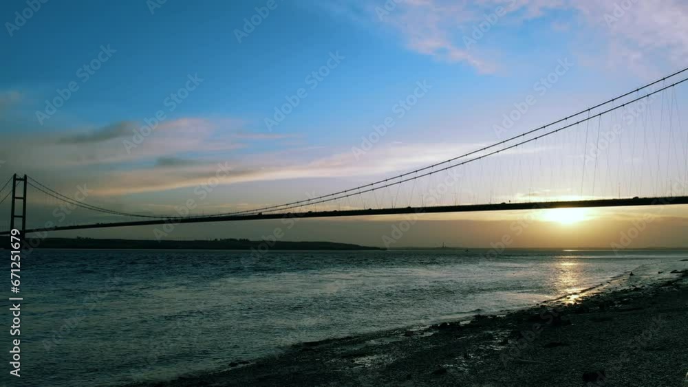 Cinematic view of the sunset behind the bridge Cinematic view of the sunset behind the bridge