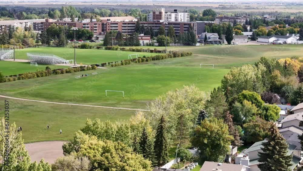 Aerial video of River Heights, Saskatoon, SK, highlighting its scenic river proximity, tree-lined avenues, and cozy homes. A community nestled between nature and city life. Aerial video of River Heights, Saskatoon, SK, highlighting its scenic river proximity, tree-lined avenues, and cozy homes. A community nestled between nature and city life.