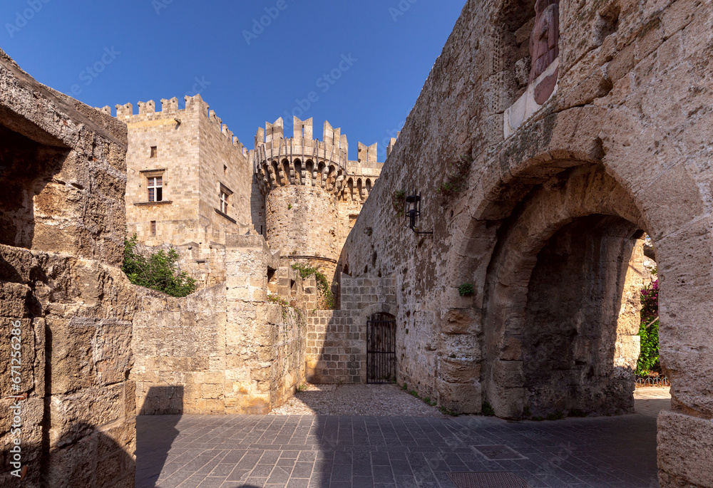 Stone towers and walls of old medieval fortifications on the Island of Rhodes.