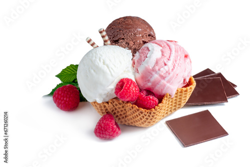 Three different scoops of ice cream lie in a waffle basket on a white background