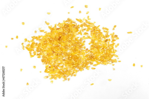 Pile of bulgur raw grain isolated at white background. 