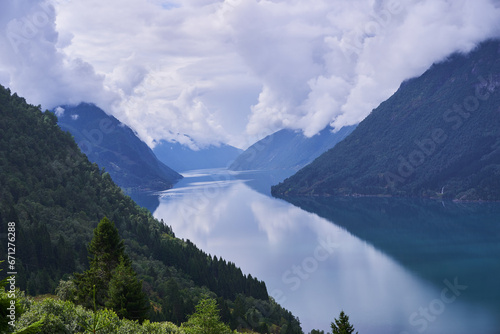 Landscape picture of the large and beautiful fjord between high mountains in the south west part of Norway. Great destination to spent there active family holiday in the summer.