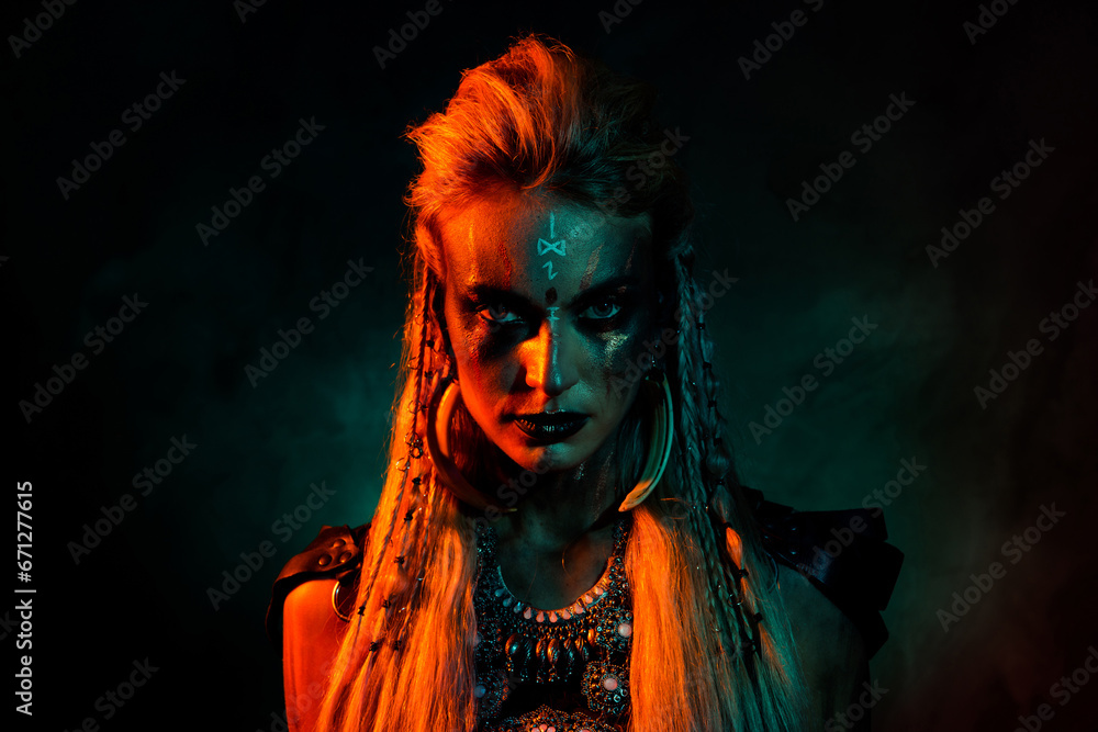 Photo of cool scary mystic woman wear gothic valkyrie costume suspicious looking you isolated orange color background Photo of cool scary mystic woman wear gothic valkyrie costume suspicious looking you isolated orange color background