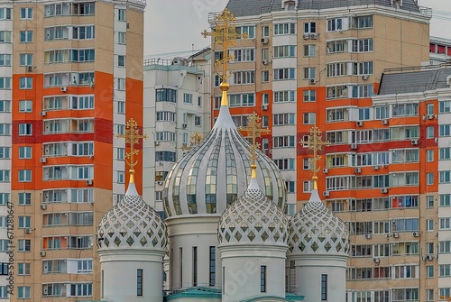 Church in white colors against residential building