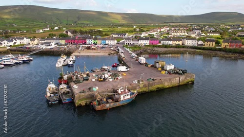 IRELAND- 8.27.2023 -Excellent aerial footage of a harbor with many boats docked off the coast of Portmagee, Ireland. photo