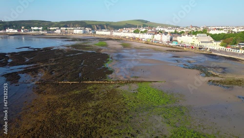 Wallpaper Mural ISLE OF MAN- 8.27.2023 -Excellent aerial footage moving from the marsh to the coast of Douglas, the Isle of Man, where a Ferris wheel sits. Torontodigital.ca