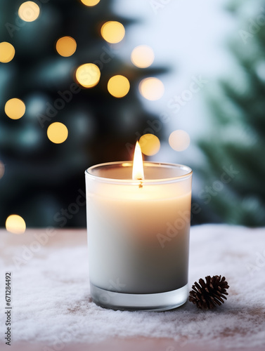 Holiday candle commercial, front view of burning candle in glass jar mock-up on Christmas background with winter decorations and bokeh © Daria Minaeva