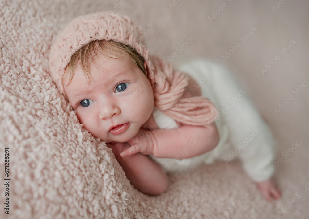 Sleeping newborn baby girl in knitted suit Sleeping newborn baby girl in knitted suit