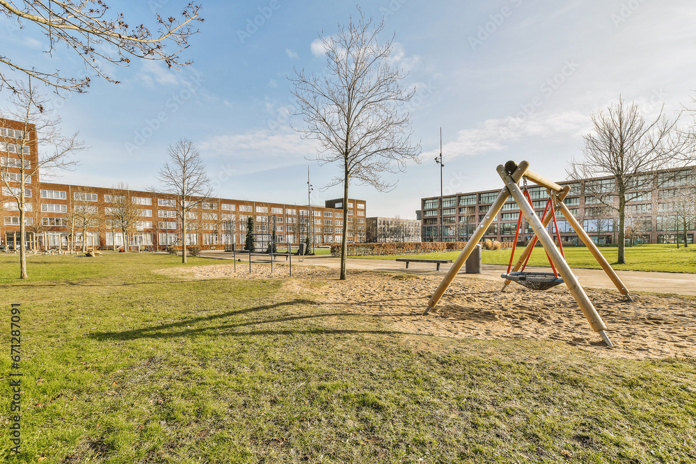 Playground and buildings in city against sky Playground and buildings in city against sky