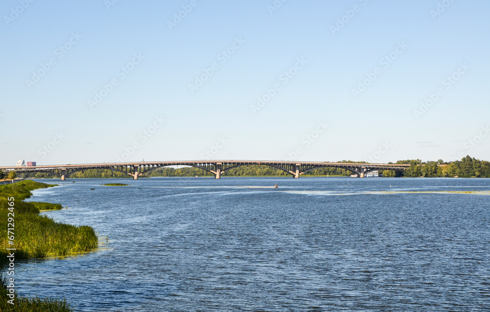 Metro bridge and Dnipro river at sunny day. Kyiv, Ukraine
