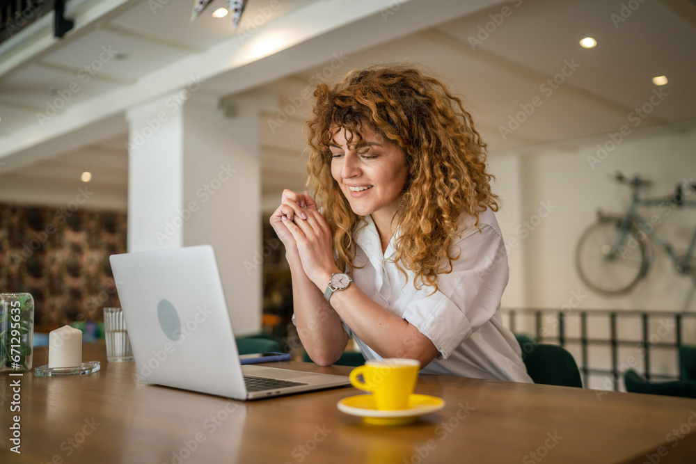 Woman use work on laptop from cafe happy smile adult caucasian Woman use work on laptop from cafe happy smile adult caucasian
