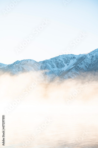 Fototapeta Naklejka Na Ścianę i Meble -  Morning mist on the mountain lake in New Zealand