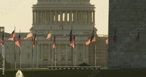 US Capitol Dome with Washington Monument and Flags in Foreground photo