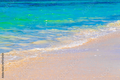 Fototapeta Naklejka Na Ścianę i Meble -  Waves at tropical beach caribbean sea clear turquoise water Mexico.