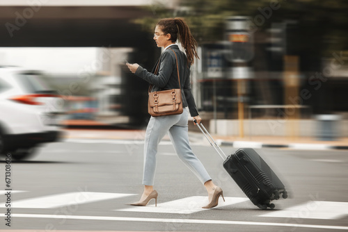 Business travel, phone and woman with luggage in city street for location, search or texting. Smartphone, app and blur with suitcase in New York online for fast transport, taxi or service request photo