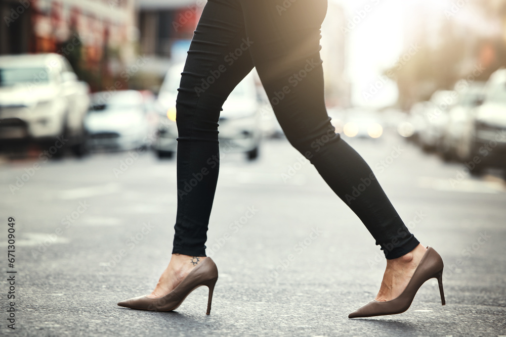 High heels, business and woman crossing the street closeup in a city on her commute to work. Feet, fashion and a female employee walking on an asphalt road in an urban town for a professional career High heels, business and woman crossing the street closeup in a city on her commute to work. Feet, fashion and a female employee walking on an asphalt road in an urban town for a professional career