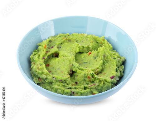 Bowl of delicious guacamole isolated on white