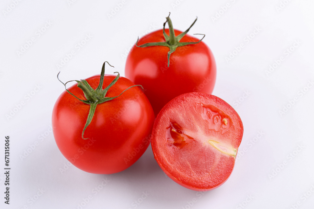 Whole and ripe red tomatoes on white background Whole and ripe red tomatoes on white background