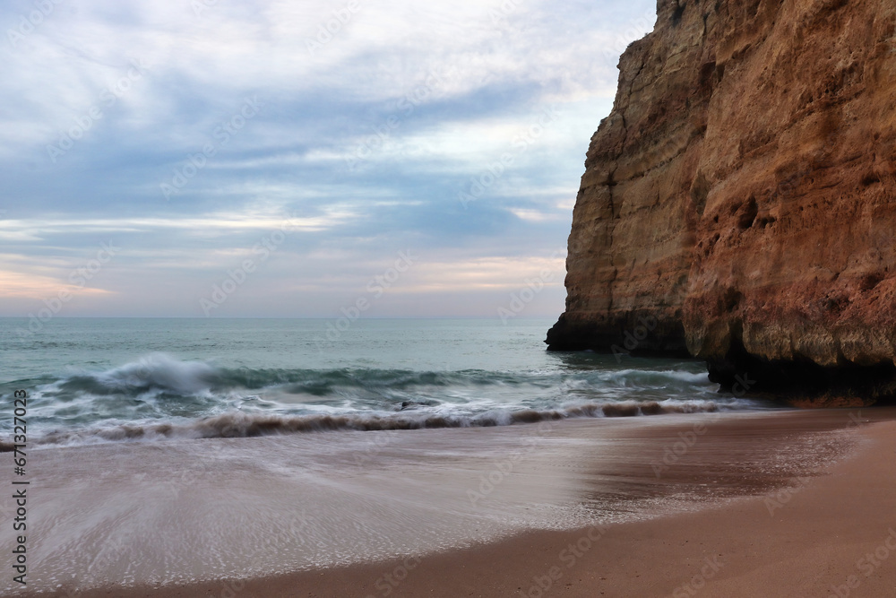 Water going out on a beach in southern Portugal on a winter evening.