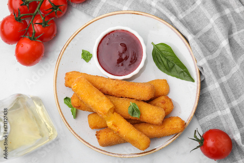 Tasty fried mozzarella sticks served with tomato sauce on white table  flat lay