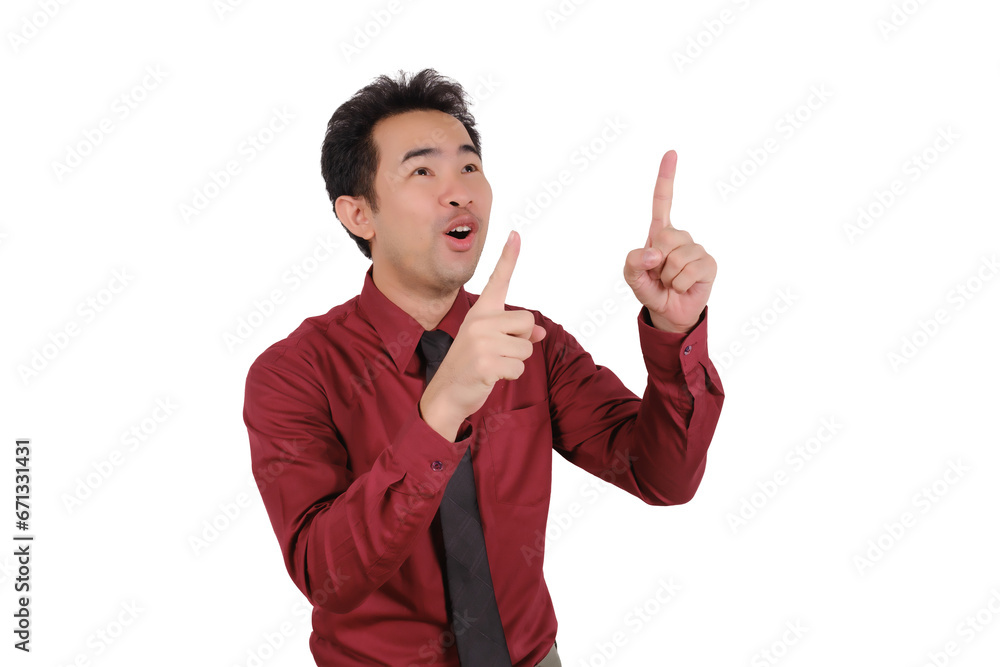 Asian male businessman pointing his finger at empty space, smiling face Asian male businessman pointing his finger at empty space, smiling face