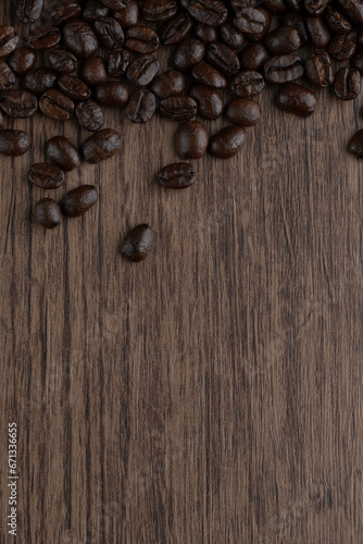 Roasted coffee bean on wooden table..