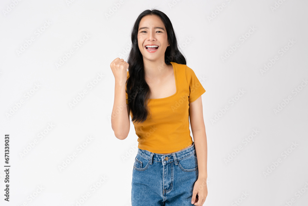 Beautiful Asian woman raises arms and fists clenched with shows strong powerful, celebrating victory expressing success. Beautiful Asian woman raises arms and fists clenched with shows strong powerful, celebrating victory expressing success.