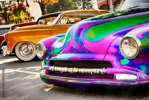 Psychedelic customized vintage car on display.